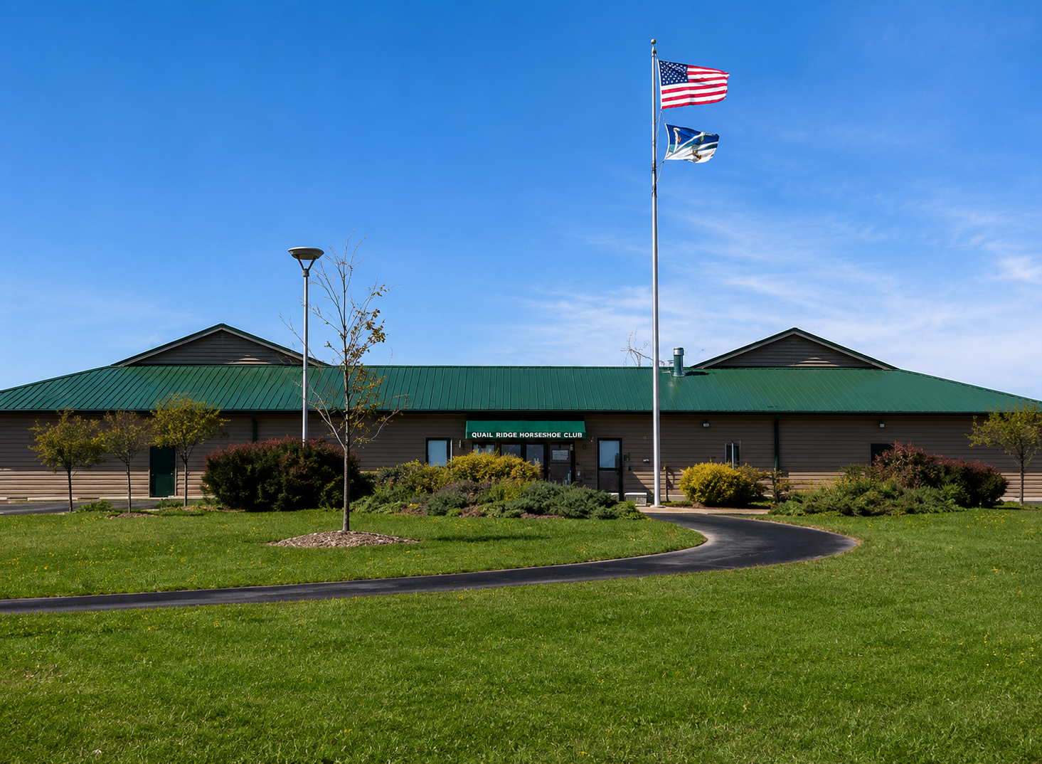 Wide view of the pristine horseshoe courts at Quail Ridge, showcasing the well-maintained grounds and professional setup in Wentzville.